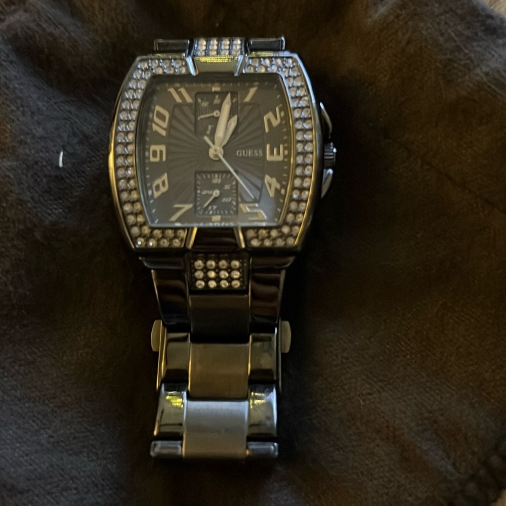 Authentic Guess gunmetal watch with crystal face.